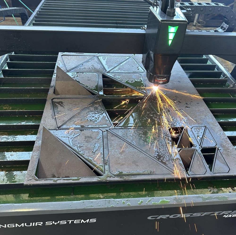 Cutting gussets on the CNC plasma, on parameters I developed for ¼-inch steel.